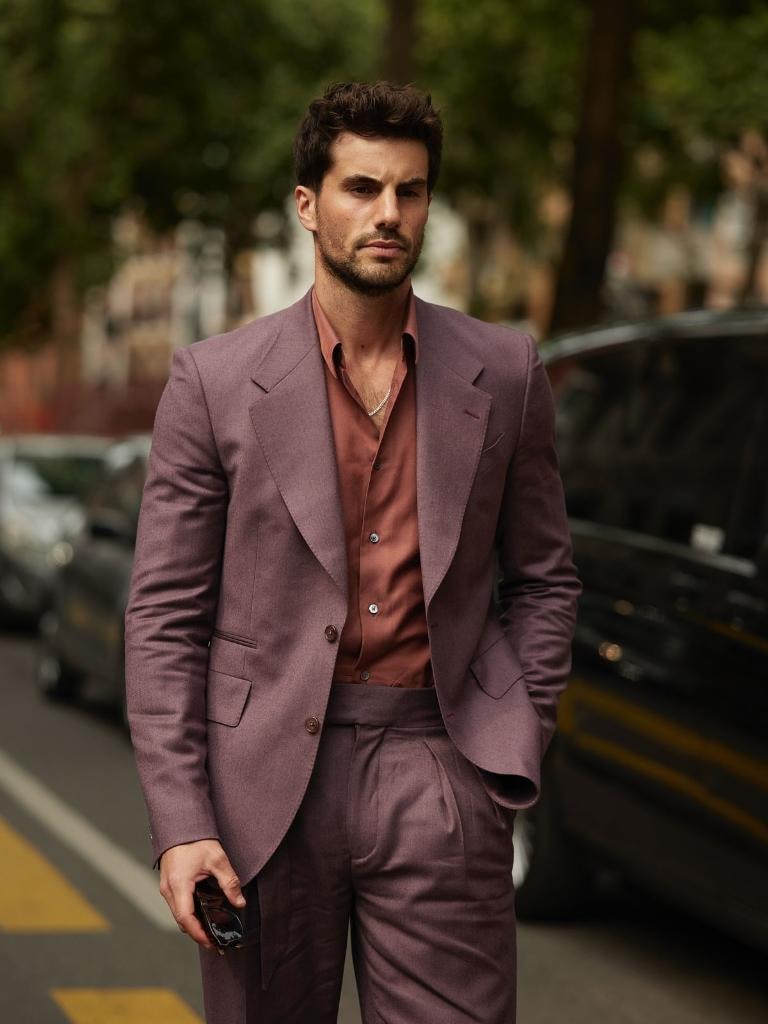 Man in mauve suit on street