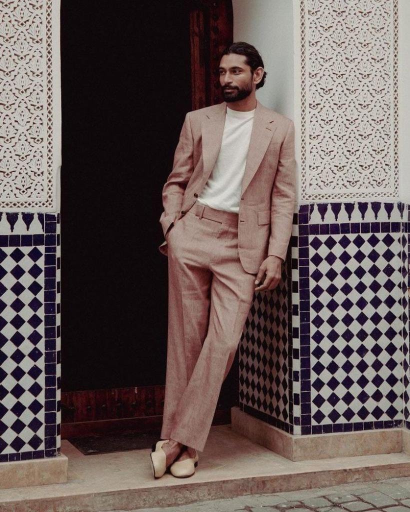 Man in pink linen suit